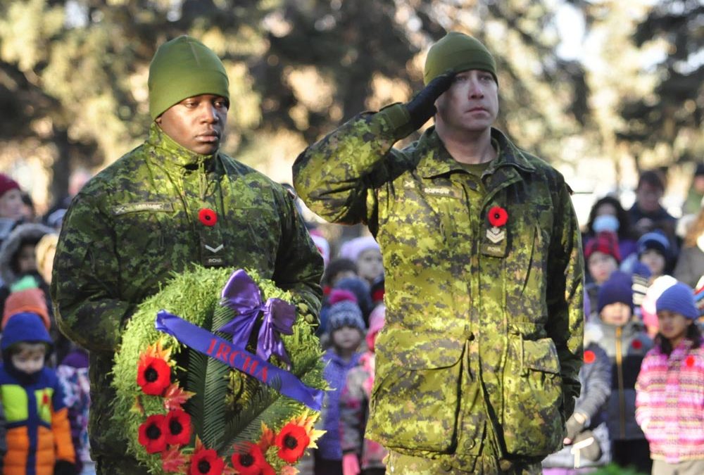 Students leave poppies at veterans’ graves