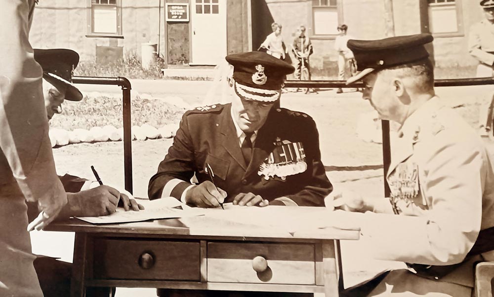 BComd Col Douglas Gunter sits with the Royal family during Queen Elizabeth II's visit to CFB Shilo in 1970.