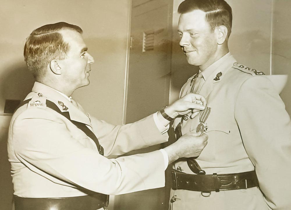 BComd Col Douglas Gunter sits with the Royal family during Queen Elizabeth II's visit to CFB Shilo in 1970.