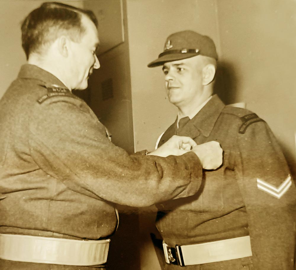 BComd Col Douglas Gunter sits with the Royal family during Queen Elizabeth II's visit to CFB Shilo in 1970.