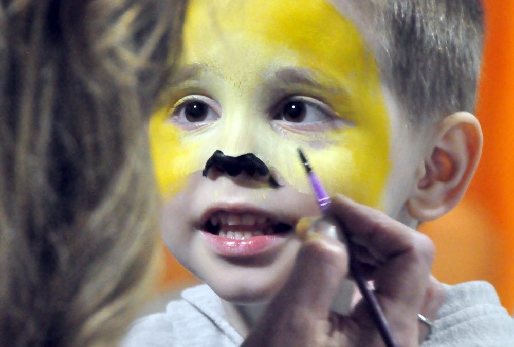 PHOTO ESSAY:  Face painting popular with Easterfest children
