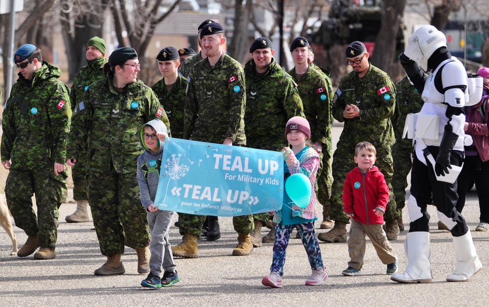 ‘Teal Up’ parade marks Month of the Military Child