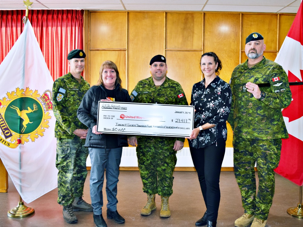 WEB-CFB Shilo United Way donation Cpl Maxime Proulx at 2018 Ex Heavy Loader Competition